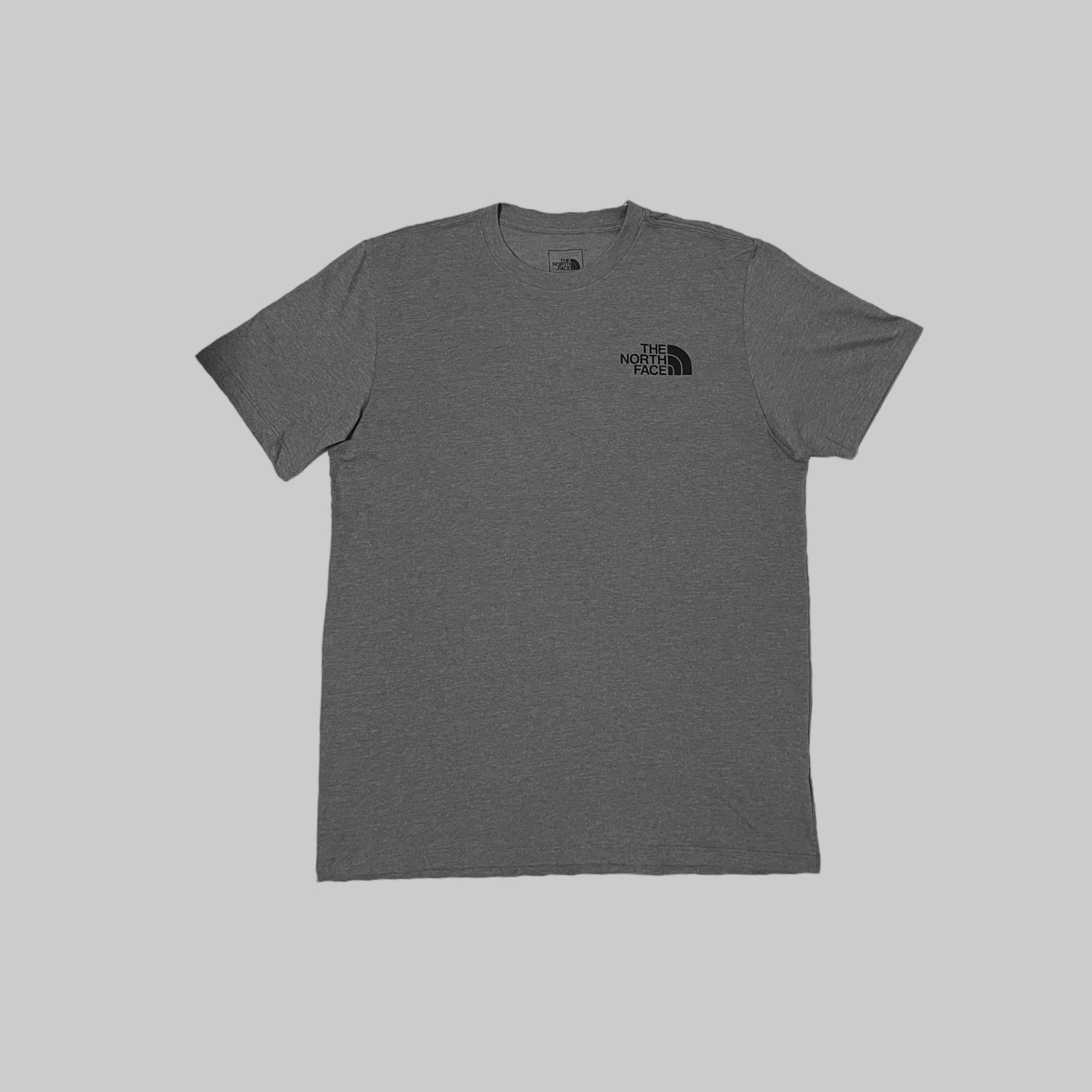 Remera The North Face BOX NSE gris